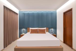 Lemon Tree Hotel, Rajkot客房内的一张或多张床位