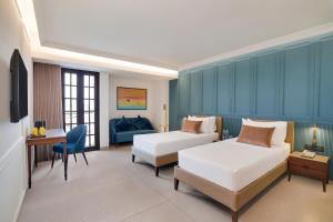 Lemon Tree Hotel, Rajkot客房内的一张或多张床位
