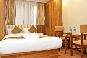 Letto o letti in una camera di Hotel Airport Gurkha