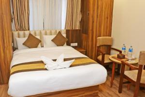 Letto o letti in una camera di Hotel Airport Gurkha