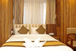 Letto o letti in una camera di Hotel Airport Gurkha