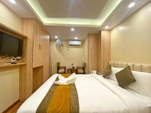 Letto o letti in una camera di Hotel Airport Gurkha