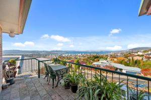 a balcony with a view of a city at Hobart Vista in Hobart