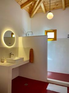 a bathroom with a sink and a mirror at Lichada Villa's in Likhás