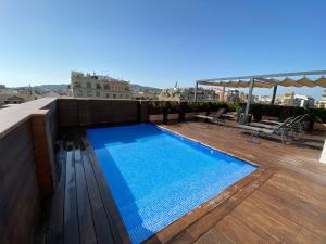 a swimming pool on the roof of a building at Chi in Barcelona