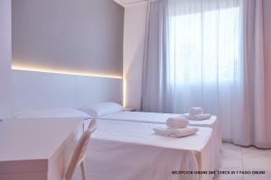 Postel nebo postele na pokoji v ubytování Hotel DL Port