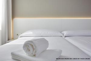 Postel nebo postele na pokoji v ubytování Hotel DL Port