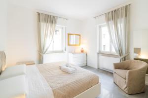 Postel nebo postele na pokoji v ubytování Relais La Torre