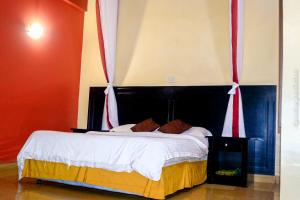 Postel nebo postele na pokoji v ubytování Jamia Central Hotel + 37 fotografií