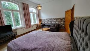 Posteľ alebo postele v izbe v ubytovaní Haus im Park