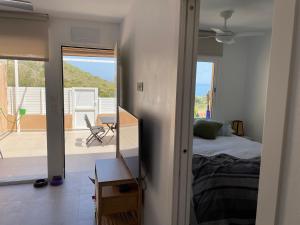 a bedroom with a bed and a view of a patio at Beach House Relax in Gran Alacant