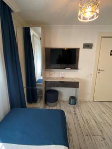 A television and/or entertainment centre at Marina Hotel Bodrum