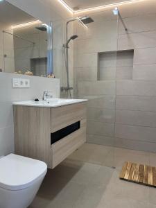 a bathroom with a toilet and a sink and a shower at Beach House Relax in Gran Alacant