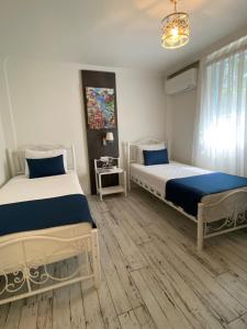 A bed or beds in a room at Marina Hotel Bodrum