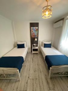 A bed or beds in a room at Marina Hotel Bodrum