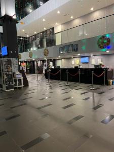 an empty lobby of an airport with a check in counter at D'Wharf Hotel & Serviced Residence in Port Dickson