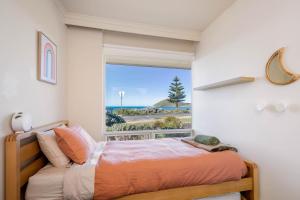 Ένα ή περισσότερα κρεβάτια σε δωμάτιο στο Frankies Beach House family and pet friendly