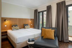 Férias no Funchal - Apartamento na Praça tesisinde bir odada yatak veya yataklar
