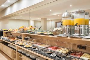 a buffet with a lot of food on display at Sunotel Central in Barcelona