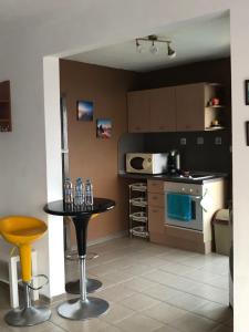 a kitchen with a table and a counter top at Apartment Terrace under the stars in Primorsko
