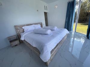 Postel nebo postele na pokoji v ubytování Kasmi Mount Batur