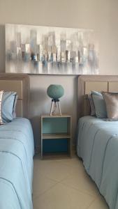 Postel nebo postele na pokoji v ubytování bel appartement équipé et spacieux avec vue magnifique sur mer
