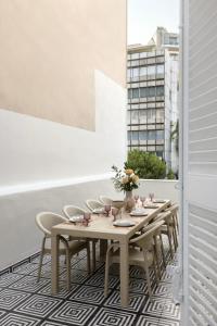 a dining room with a table and chairs at Loft in Acropolis in Athens