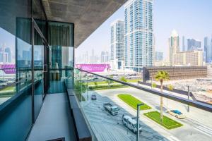 a balcony of a building with a view of a city at Fully Furnished 3BR+ Maid’s in the heart of Dubai in Dubai