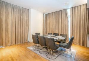a dining room with a table and chairs at Fully Furnished 3BR+ Maid’s in the heart of Dubai in Dubai