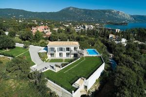 an aerial view of a large house with a yard at Secluded Elegance at Villa Giem - 4 Bedrooms - Unmatched Sea Views - Private Pool & Lush Gardens - Dassia in Dafnila