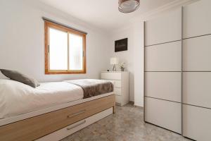 Postel nebo postele na pokoji v ubytování Deluxe House Melenara