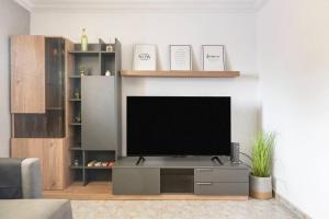 TV a/nebo společenská místnost v ubytování Deluxe House Melenara