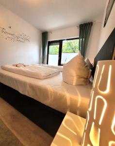 Postel nebo postele na pokoji v ubytování Winterberg Appartement 21110