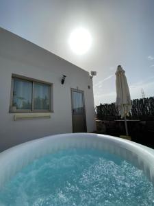 a hot tub in the backyard of a house at El Olivar Experiences - Adults Recommended in Puerto del Rosario