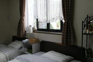 Private Inn Bambee客房内的一张或多张床位