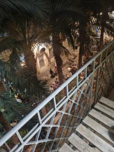 an overhead view of a building with palm trees and stairs at Fellini 8 1/2 in Haifa