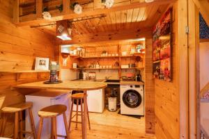 a kitchen with a counter and a washer and dryer at Apartment Berlin | Garden, Terrace, Nature in Berlin