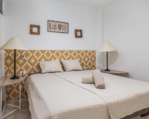 A bed or beds in a room at Los Gigantes apartamento de 3 habitaciones
