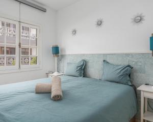 A bed or beds in a room at Los Gigantes apartamento de 3 habitaciones