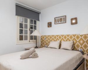 A bed or beds in a room at Los Gigantes apartamento de 3 habitaciones