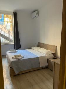a bedroom with a bed and a window at Villa Milano Apt. n. 3 in Milan