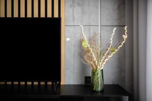 a vase of flowers sitting on a table at EASY RENT Apartments - Kompozytorów Polskich 51, Free Parking, 24h Check-in in Lublin