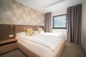 Postel nebo postele na pokoji v ubytování Hotel Panorama Resort