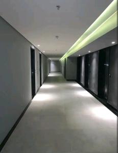 an empty hallway with lights in a building at Luxury Paiva Flat in Recife