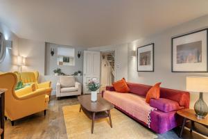 a living room with a couch and two chairs at Stay Covent Garden in London