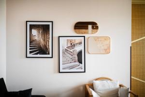 three framed pictures on a white wall at EASY RENT Apartments - Okopowa, Centrum 24h Check-in in Lublin +19 photos