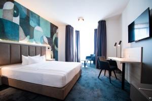 Postel nebo postele na pokoji v ubytování Taste Hotel Kulmbach + 29 fotografií