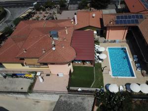 an overhead view of a house with a swimming pool at Villa Camporosso in Colà di Lazise