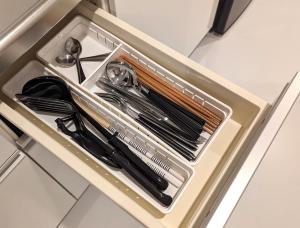 a drawer filled with utensils in a container at Center Point In Kanazawa in Kanazawa
