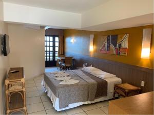 En eller flere senger på et rom på Atol das Rocas Hotel
